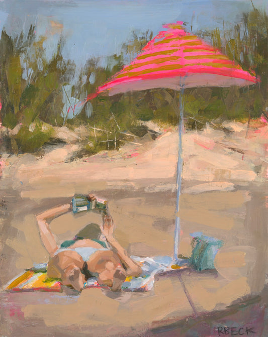 New Chapter Charleston coastal art print by artist Ryan Beck featuring a woman reading under a pink beach umbrella on the sand